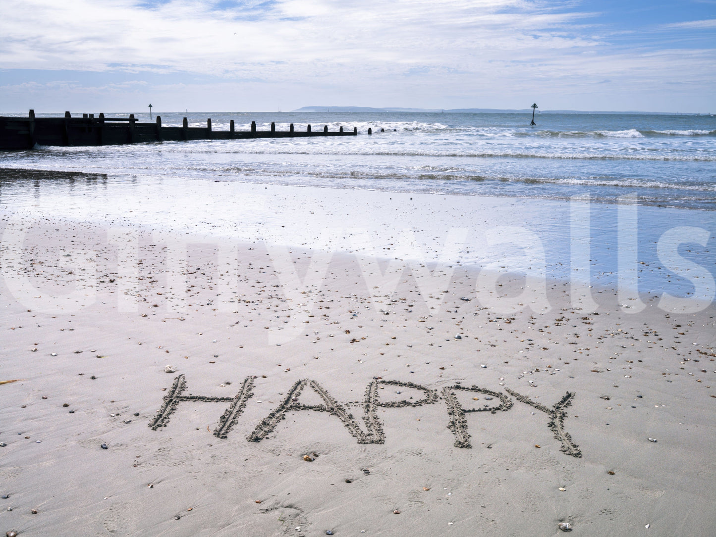 Joyful word etched Happy Beach wallpaper vast sandy expanse.
