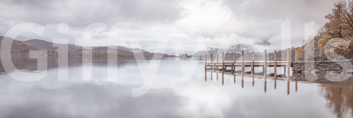 Lakeside pier mural with soft colors and scenic mountain backdrop.