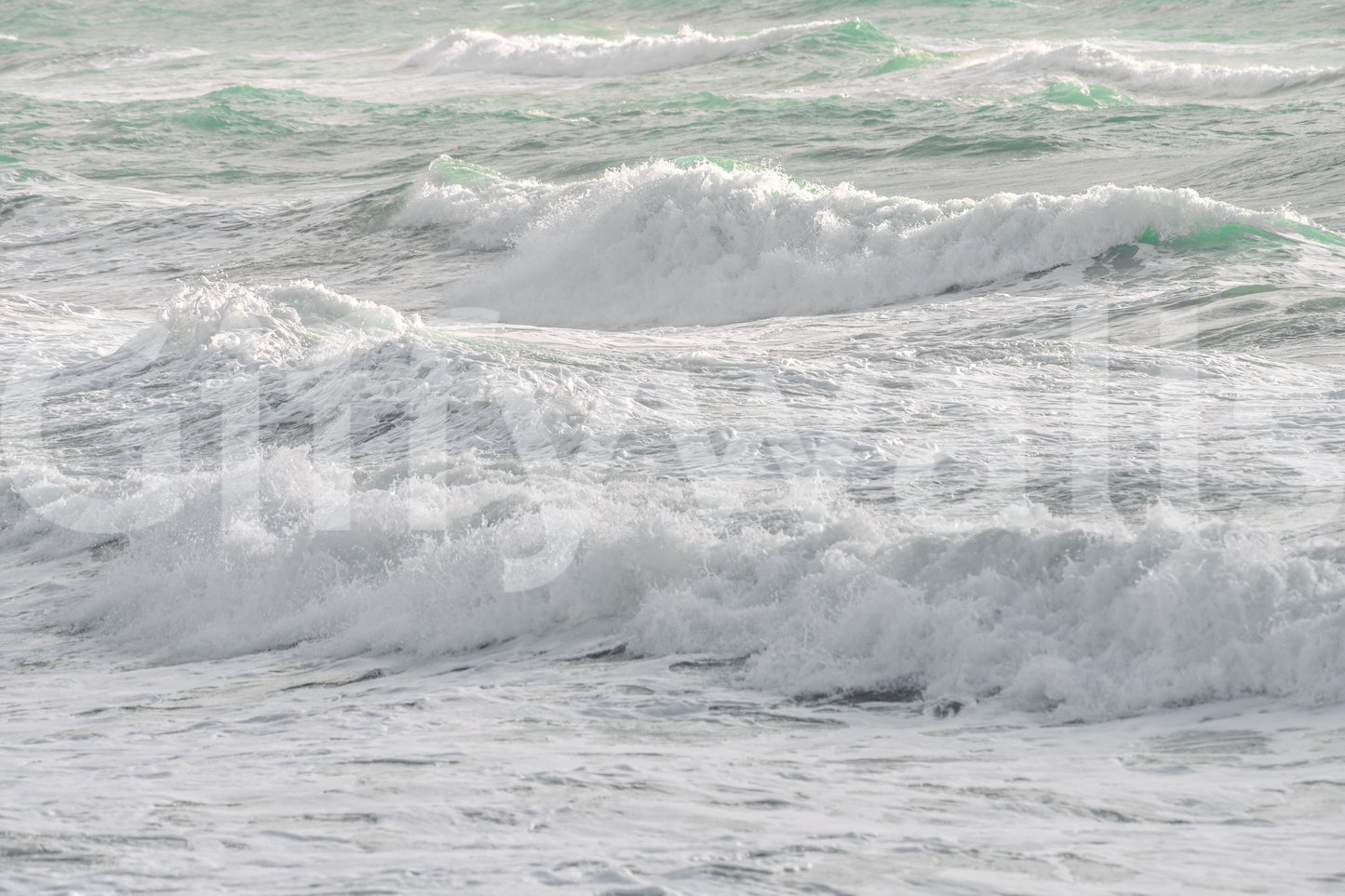 A detail of the warm tones in the ocean and sky.