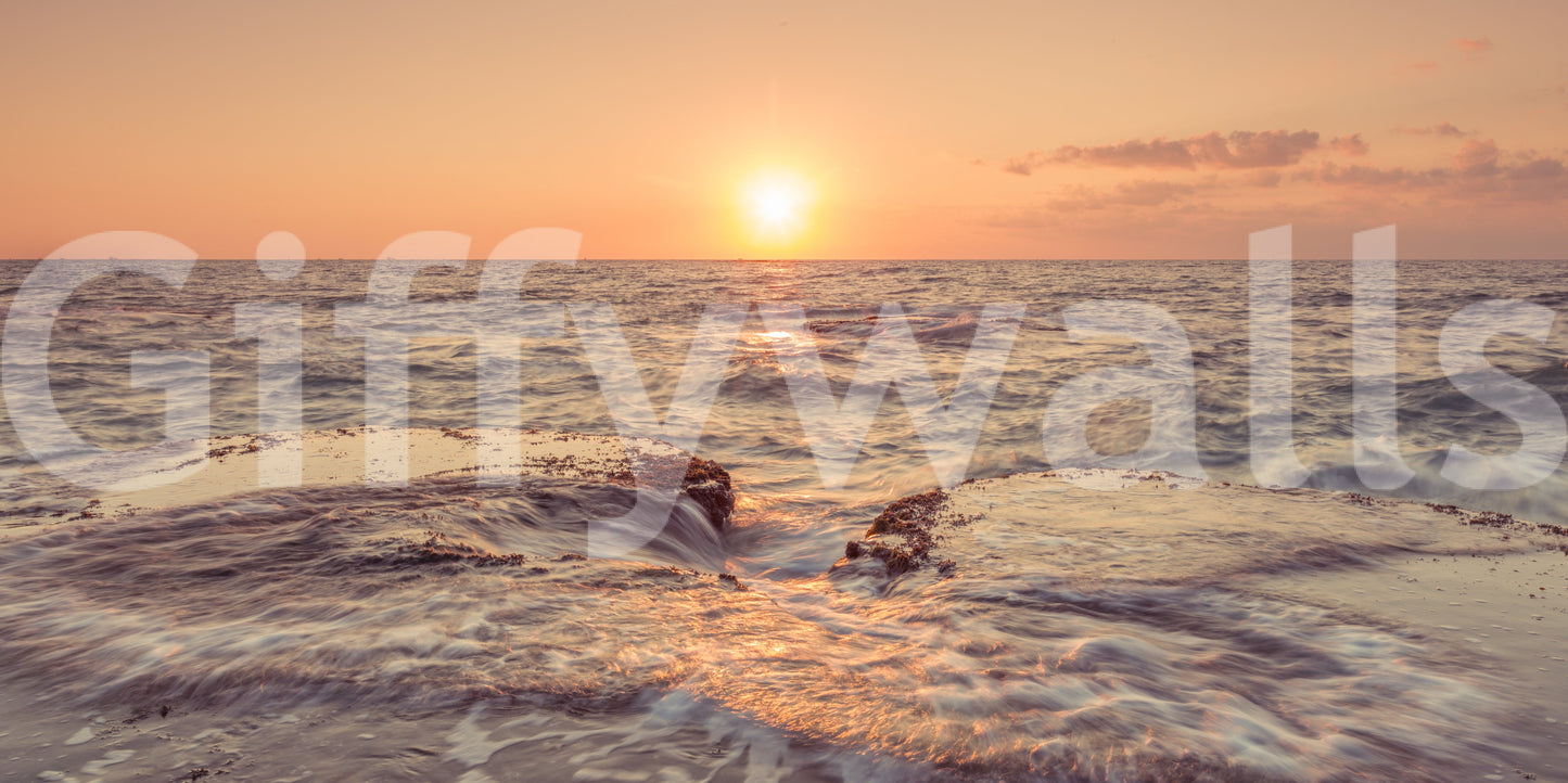 Majestic Coastal Dawn beach scene wall covering over deep blue sea.