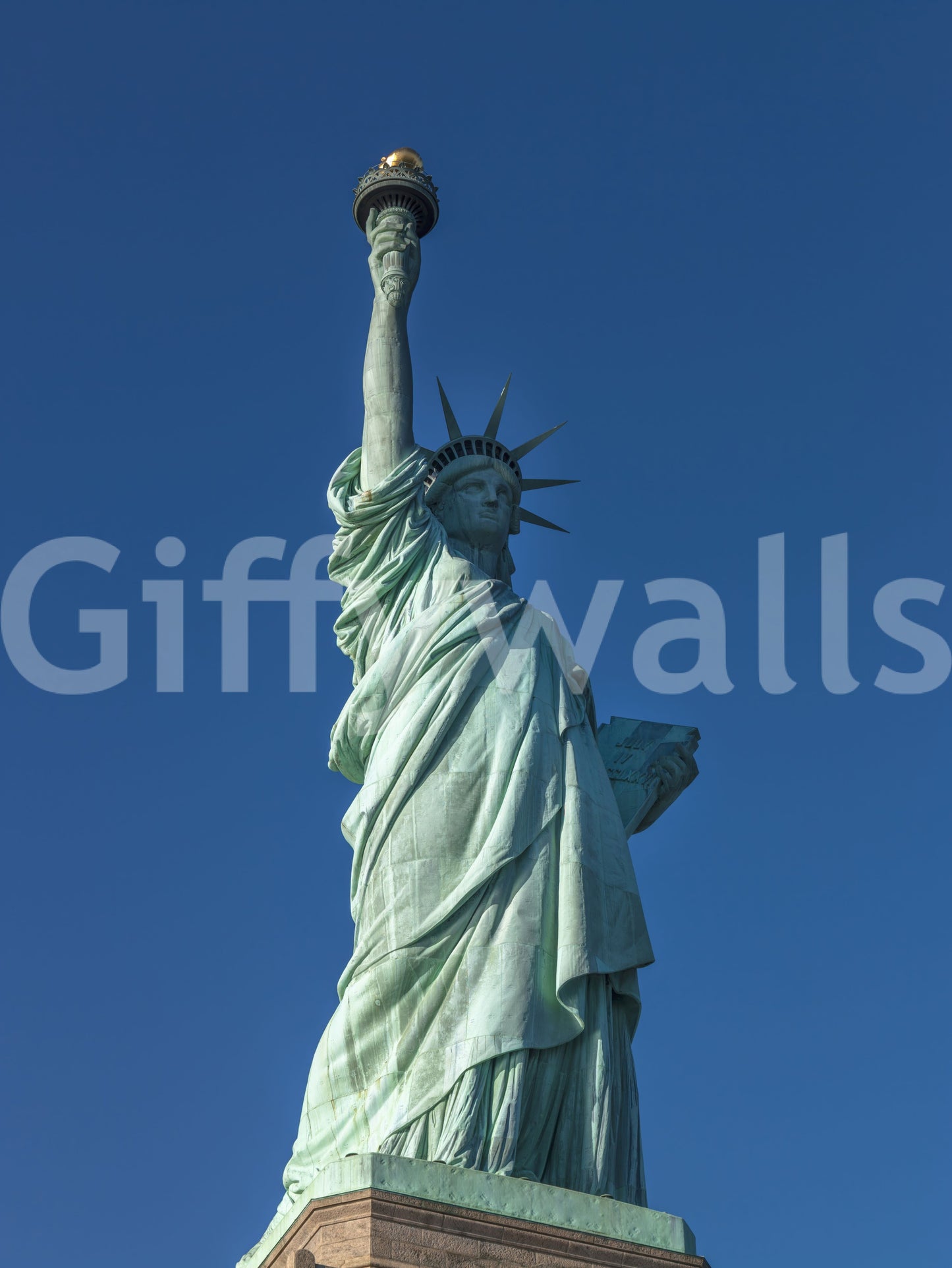 Long robe folds fall down to the base in this Liberty Azure wall mural piece