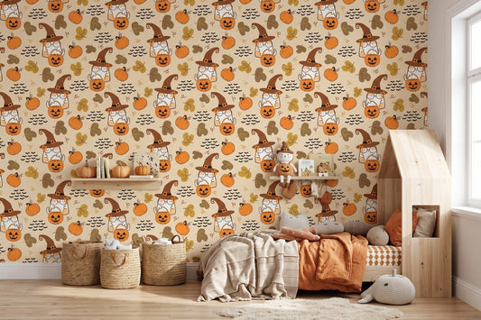 Cozy kids bedroom styled with cheerful Halloween wallpaper of cartoon cats in witch hats and glowing pumpkins on warm beige