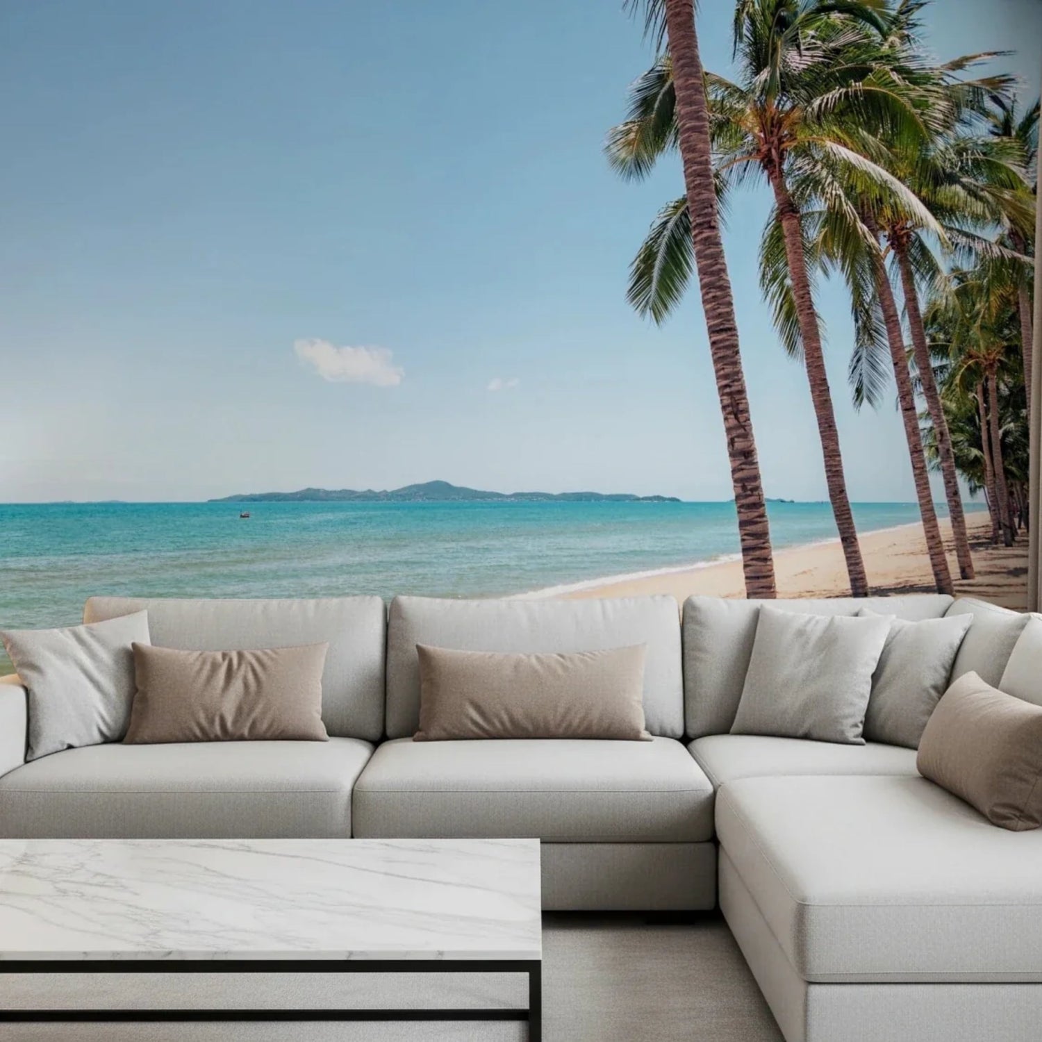 Coastal wallpaper mural with soft ocean waves printed across a living room feature wall.