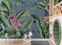 Elegant floral wallpaper mural featuring green leaves on blue.
