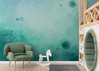 Minimalist green watercolor mural creating a soothing ambiance.
