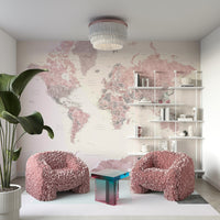 Feminine world map wallpaper in dusty pink hues

