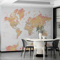Watercolor world map in gentle blush and cream hues

