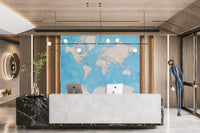 Elegant world map mural in soft blue watercolor tones


