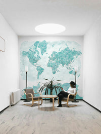 Watercolor world map with ocean-inspired blue palette

