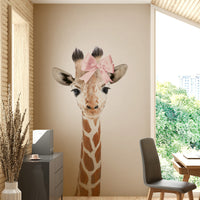 Hand-drawn baby giraffe with bow for kids’ rooms.