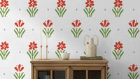 Red flower print wallpaper with green stems

