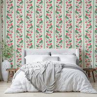 Bold red and green striped wallpaper with playful cherries

