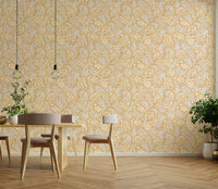 Warm ochre wallpaper with leafy sea kale print

