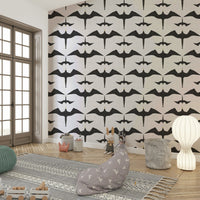Close-up of frigatebird design on white wallpaper

