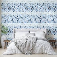 Blue ombre wall mural with artistic flower prints

