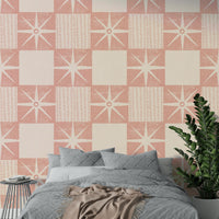 Pink starburst shapes forming a retro quilt block pattern

