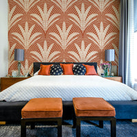 Earthy terracotta wallpaper with rustic palm motifs

