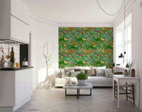 Exotic flowers and rich green leaves in tropical wallpaper design

