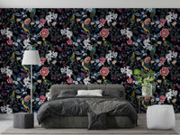 Close-up view of dark foliage and vibrant flowers in Nocturnal Paradise wallpaper.


