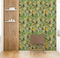 Wallpaper with monkeys interacting with colorful flowers and leaves.

