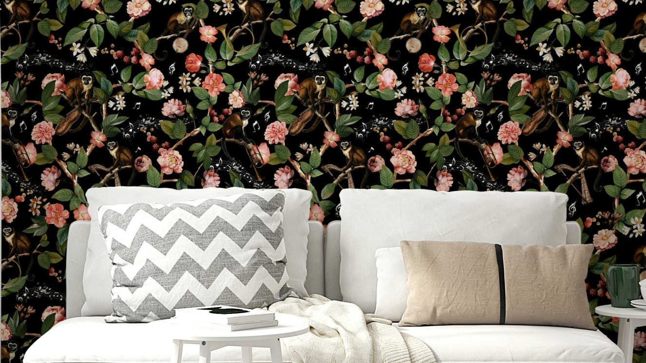 Colorful wallpaper with mischievous monkeys and tropical blooms.

