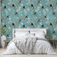 Playful jungle wallpaper featuring primates surrounded by vibrant flowers.

