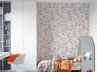 Vintage wallpaper with romantic florals on a textured base.

