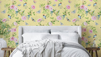 Pastel Paradise Chinoiserie Wallpaper with soft yellow background and birds.

