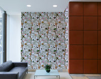Subtle botanical wallpaper featuring leaves and muted floral accents.

