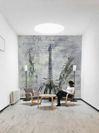 Collage-style mural of Paris architecture and tower

