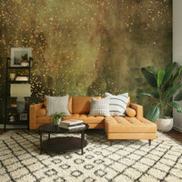 Swirling olive galaxy mural wallpaper with gold accents.

