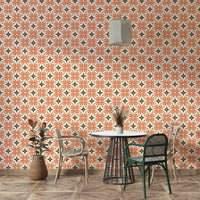Geometric floral pattern wallpaper in warm orange and brown.

