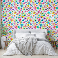 Bright tropical blooms on wallpaper with a fluid, painted look.

