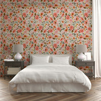 Wallpaper with tropical flowers in warm coral and cream hues.

