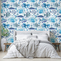 Colorful underwater scene with reef fish and flowing coral shapes.

