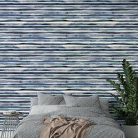 Wallpaper with smooth blue stripes and soft watercolor texture.


