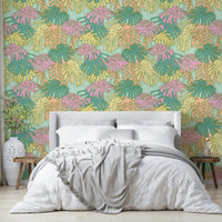 Aqua and pastel green Monstera leaf wallpaper with vintage Palm Springs style.

