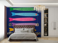 Rainbow fish swimming in a lively mural on royal blue wallpaper.

