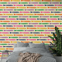 Colorful rainbow fish on cream wallpaper for a joyful, whimsical space.

