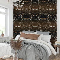 Wall mural of vines and moths in brown and grey

