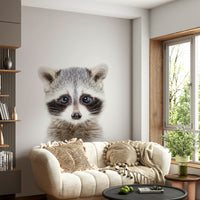 Raccoon-themed nursery wall with mural wallpaper

