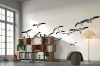 Horizontal wall mural with graceful birds flying against a calm sky.

