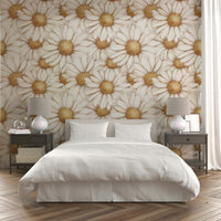Delicate golden daisy design on soft-toned mural wallpaper.

