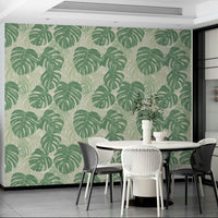 Lush monstera leaves on wallpaper for a nature-filled room.


