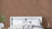 Warm-toned wallpaper with subtle ogee damask motif

