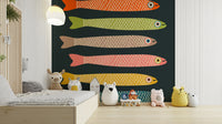 Quirky fish mural with vibrant multicolored anchovies on charcoal.

