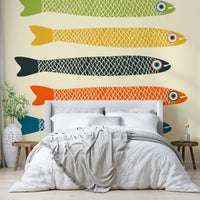 Anchovies fish wall mural on cream background for quirky decor.

