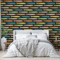 Playful fish design in multicolors on a charcoal background.

