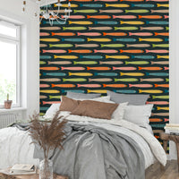 Charcoal wallpaper with playful multicolored fish for lively rooms.

