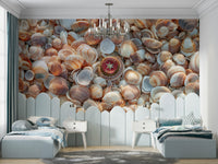 Coastal beach treasures mural featuring seashells on the sand.


